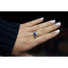 18K White Gold Bezel and Channel Set Oval Cut Blue Sapphire & Baguette Diamond Ring