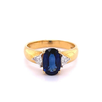 2.32 Carat Oval Cut Blue Sapphire with Trillion Cut Diamond Side stones in 18k Yellow Gold Ring – Assay Jewelers