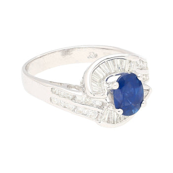 Natural 1.14 Carat Oval Cut Blue Sapphire with Round & Baguette Cut Diamonds in a Swirled 18K White Gold Ring Setting – Assay Jewelers
