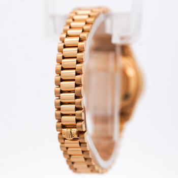 Montre Rolex Datejust 6917 26 mm en or 18K, bracelet President, lunette diamantée, cadran noir – Assay Jewelers
