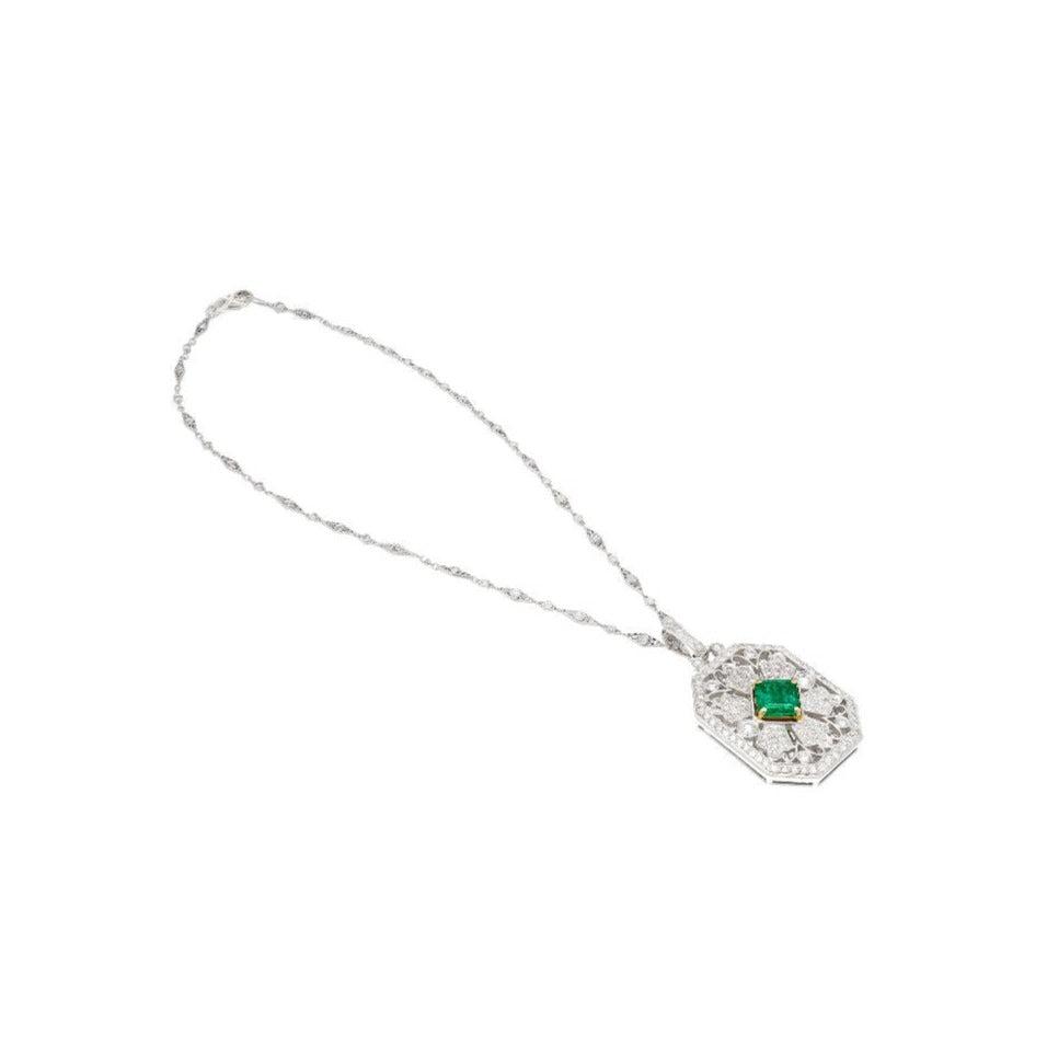 Vintage Carved Platinum 3.16 Carat Vivid Green Minor Oil Emerald Pendant with 4 CTTW in Diamonds