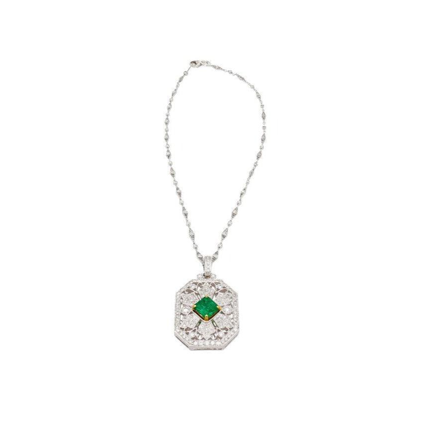 Vintage Carved Platinum 3.16 Carat Vivid Green Minor Oil Emerald Pendant with 4 CTTW in Diamonds