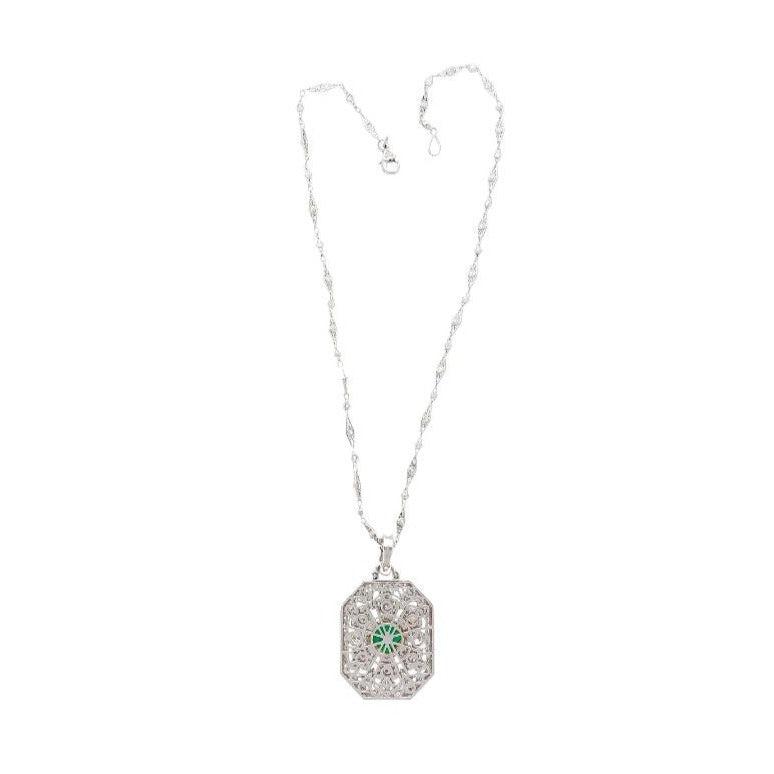 Vintage Carved Platinum 3.16 Carat Vivid Green Minor Oil Emerald Pendant with 4 CTTW in Diamonds