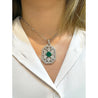 Vintage Carved Platinum 3.16 Carat Vivid Green Minor Oil Emerald Pendant with 4 CTTW in Diamonds