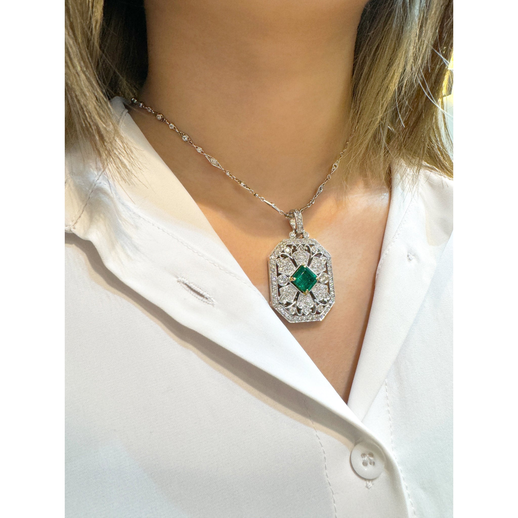 Vintage Carved Platinum 3.16 Carat Vivid Green Minor Oil Emerald Pendant with 4 CTTW in Diamonds